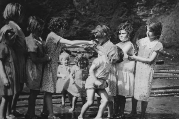 Playing on the beach, c1935