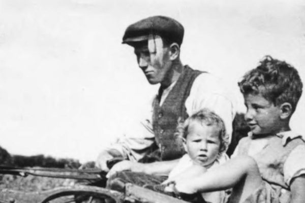Sam Blake with the Parsons' children in the cart, c 1935